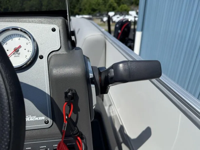 Slide: The Image of Close-up of 2026 Sun Tracker PARTY BARGE® 16 DLX dashboard with RPM gauge and throttle. - 10