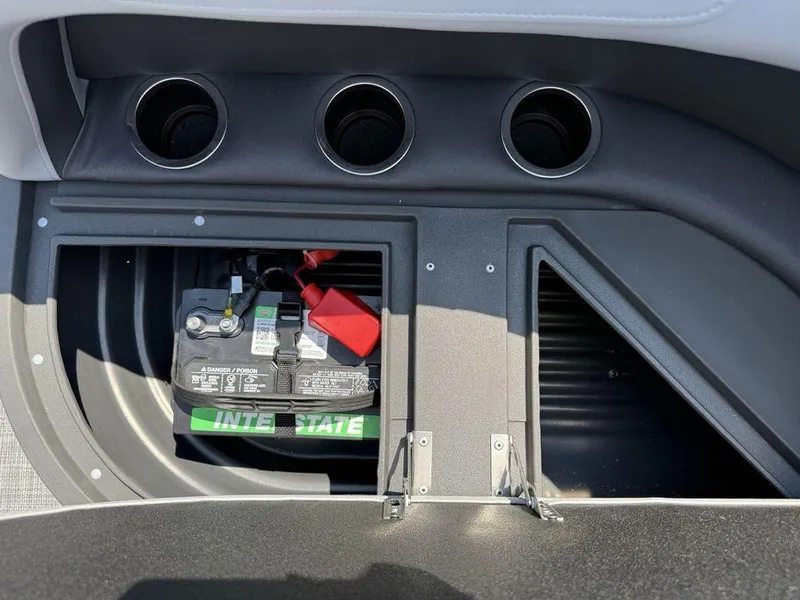 Slide: The Image of Battery compartment of 2026 Sun Tracker PARTY BARGE® 16 DLX with cup holders. - 17