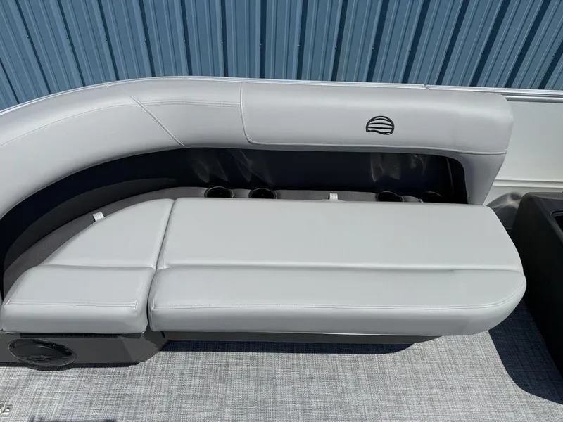 Slide: The Image of 2026 Sun Tracker PARTY BARGE® 16 DLX pontoon boat seating, featuring sleek white upholstery. - 7