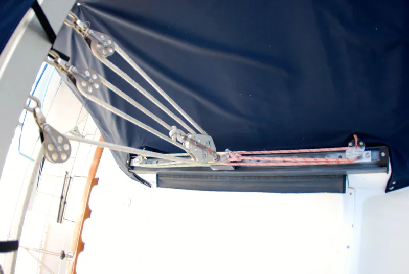 Slide: The Image of Sailing rigging on a 1985 Endeavour 38 yacht, featuring pulleys and ropes. - 14