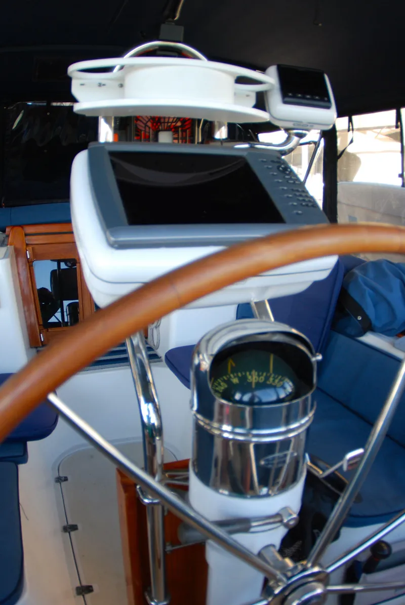 Slide: The Image of Cockpit of 1985 Endeavour 38 sailboat with navigation equipment and compass. - 26