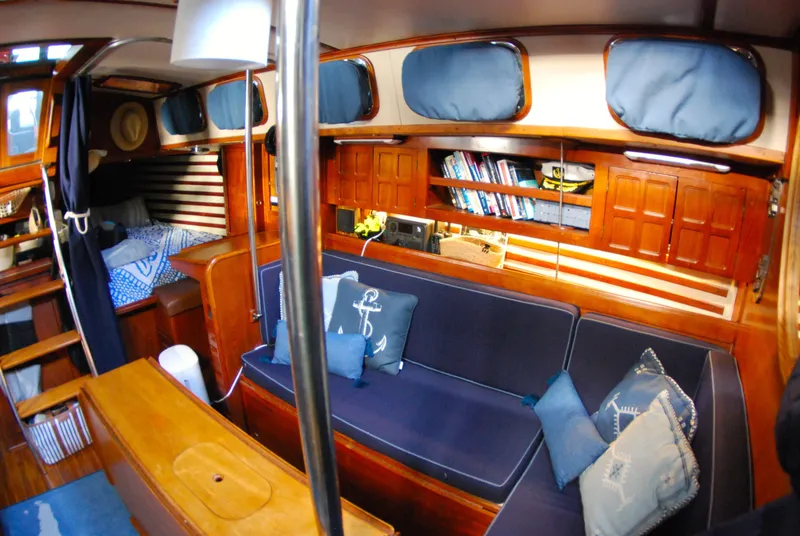 Slide: The Image of Interior of 1985 Endeavour 38 sailboat with cozy seating and nautical decor. - 31