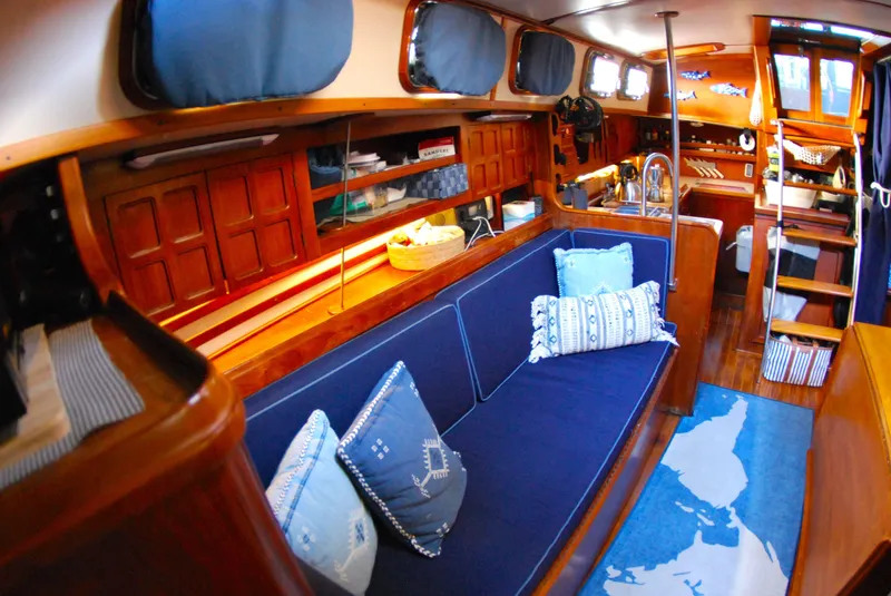 Slide: The Image of Interior of 1985 Endeavour 38 sailboat with cozy seating and nautical decor. - 32