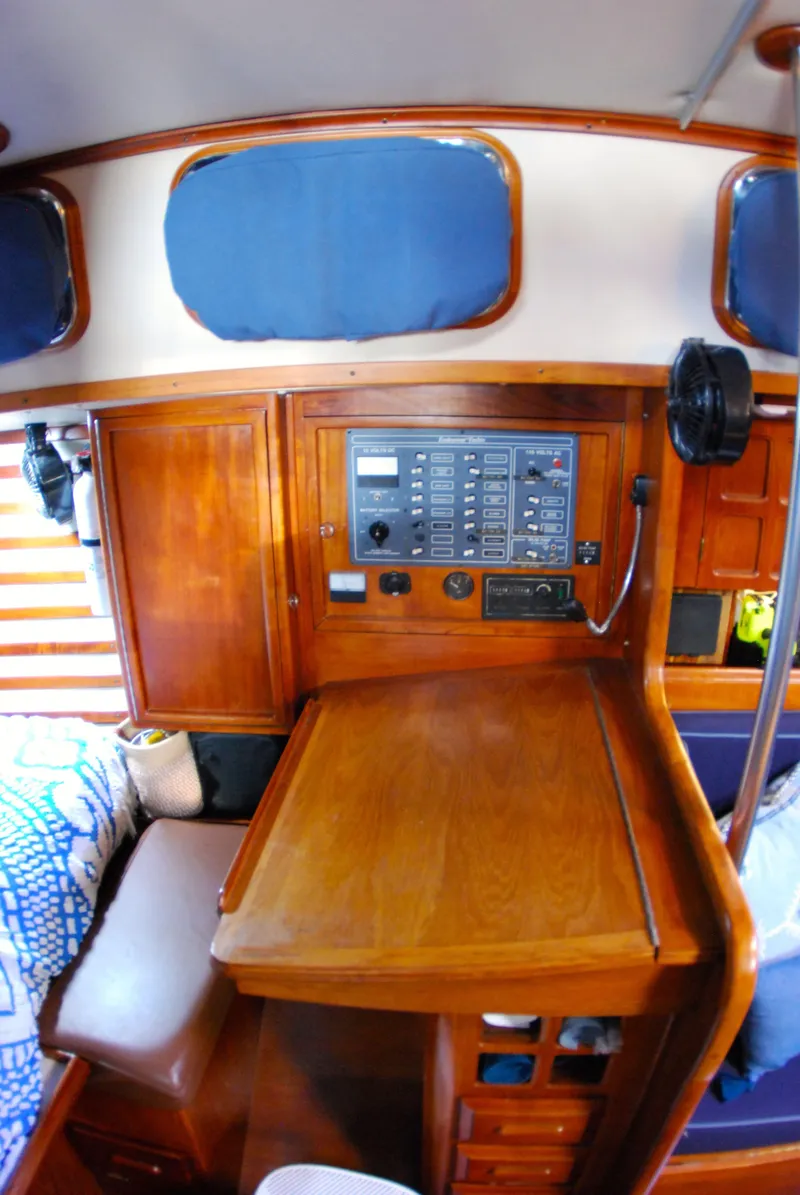 Slide: The Image of Interior of 1985 Endeavour 38 sailboat with wooden navigation station and control panel. - 34