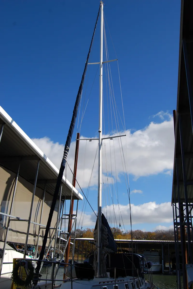 Slide: The Image of 1985 Endeavour 38 sailboat docked under clear blue sky. - 4