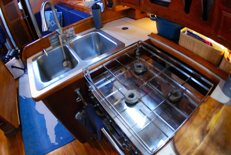 Slide: The Image of Compact kitchen in 1985 Endeavour 38 sailboat with stove and double sink. - 40