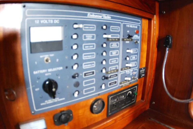 Slide: The Image of Electrical control panel on a 1985 Endeavour 38 sailboat, featuring switches and dials. - 44