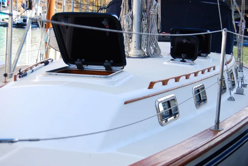 Slide: The Image of 1985 Endeavour 38 sailboat deck with open hatches and rigging. - 8