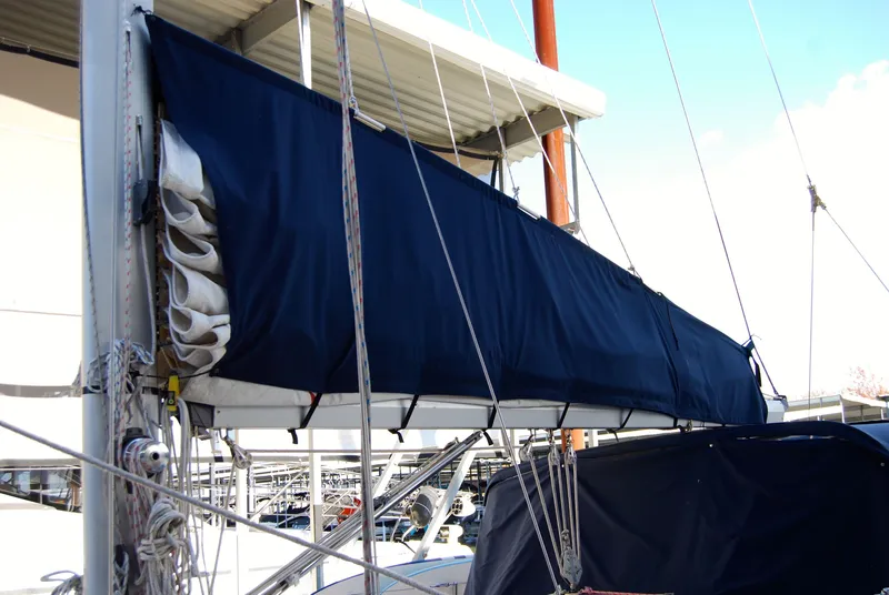 Slide: The Image of 1985 Endeavour 38 sailboat with blue sail cover and rigging details. - 9