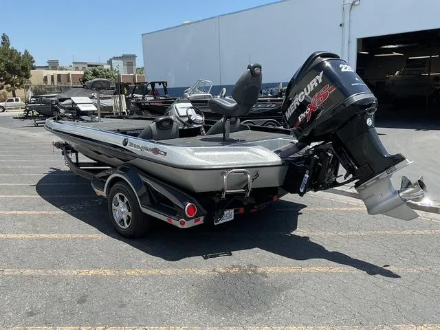 Slide: The Image of 2015 Ranger Z119C Comanche Fusion boat with Mercury Pro XS engine in parking lot. - 5