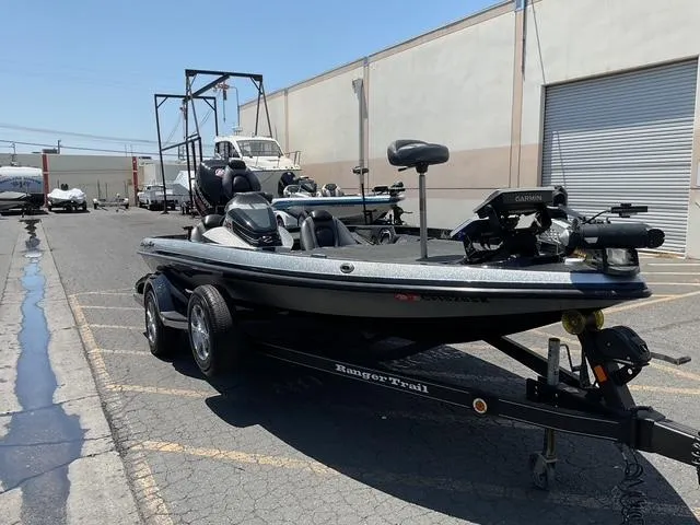 Slide: The Image of 2015 Ranger Z119C Comanche Fusion boat on trailer in industrial area. - 7