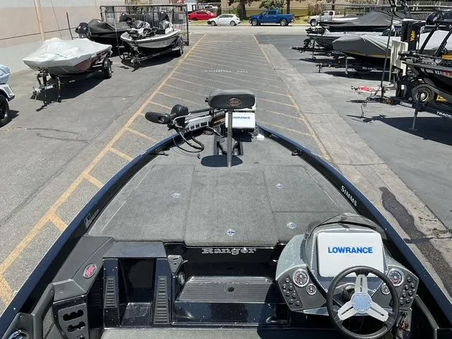 Slide: The Image of 2015 Ranger Z119C Comanche Fusion boat with Lowrance electronics in a parking lot. - 9