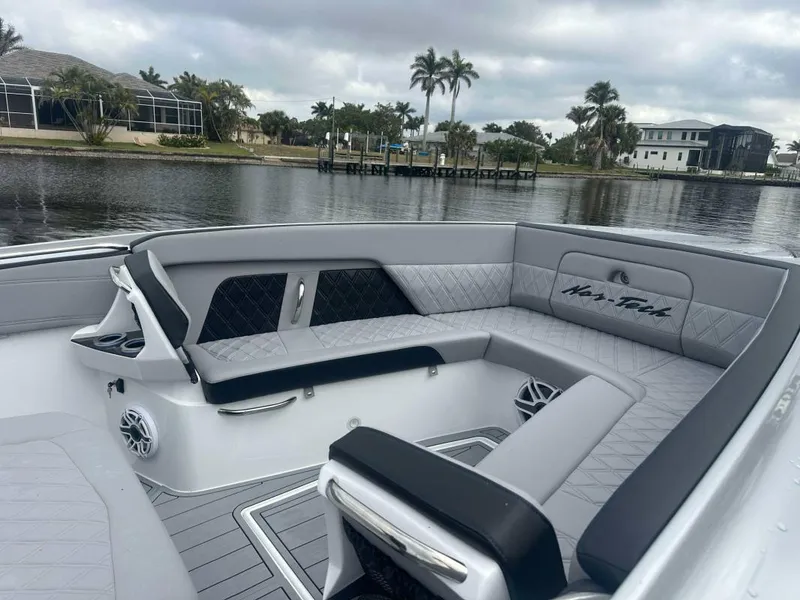 Slide: The Image of Luxurious seating on 2025 Nor-Tech 400SS boat with waterfront view. - 6