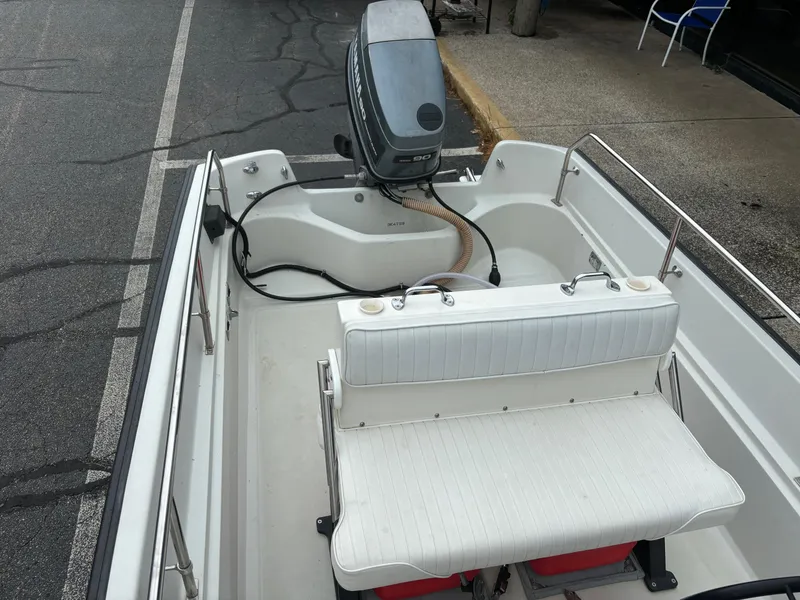 Slide: The Image of 1993 Boston Whaler 17 Montauk boat interior with Yamaha outboard motor. - 12
