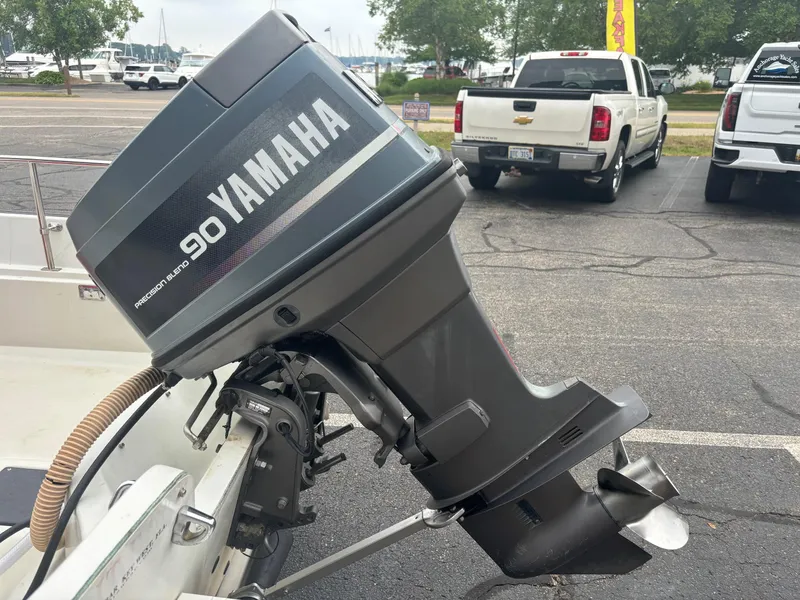 Slide: The Image of 1993 Boston Whaler 17 Montauk with Yamaha 90 outboard motor in parking lot. - 16