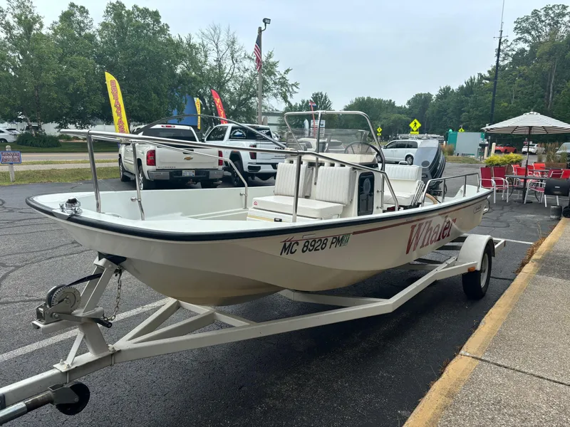 Slide: The Image of 1993 Boston Whaler 17 Montauk boat on trailer in parking lot. - 3