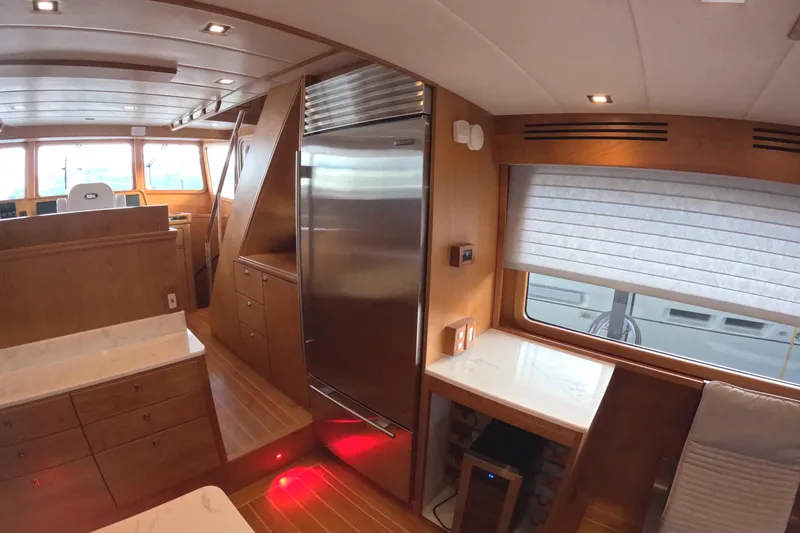 Slide: The Image of Luxurious interior of 2021 Kadey-Krogen 50 Open yacht with modern kitchen and seating area. - 10