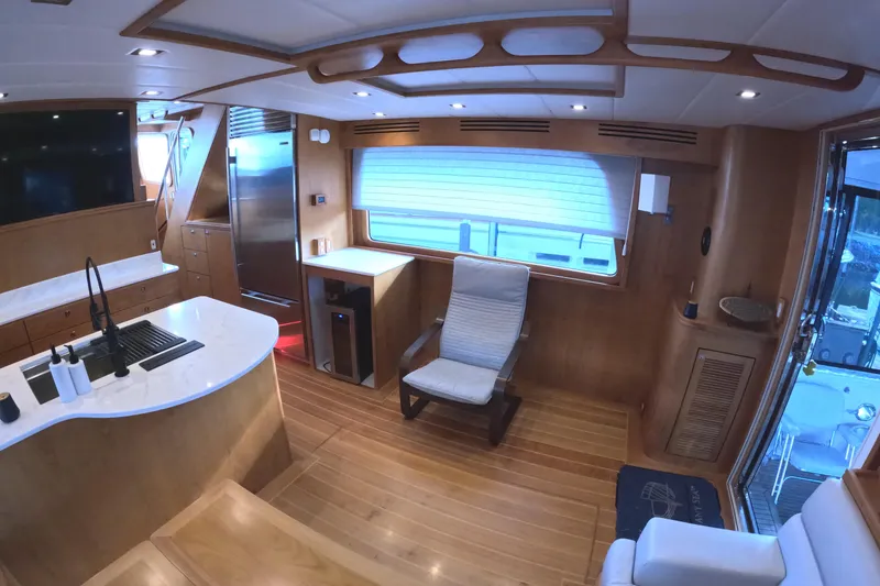 Slide: The Image of Luxurious interior of 2021 Kadey-Krogen 50 Open yacht with modern kitchen and seating area. - 12