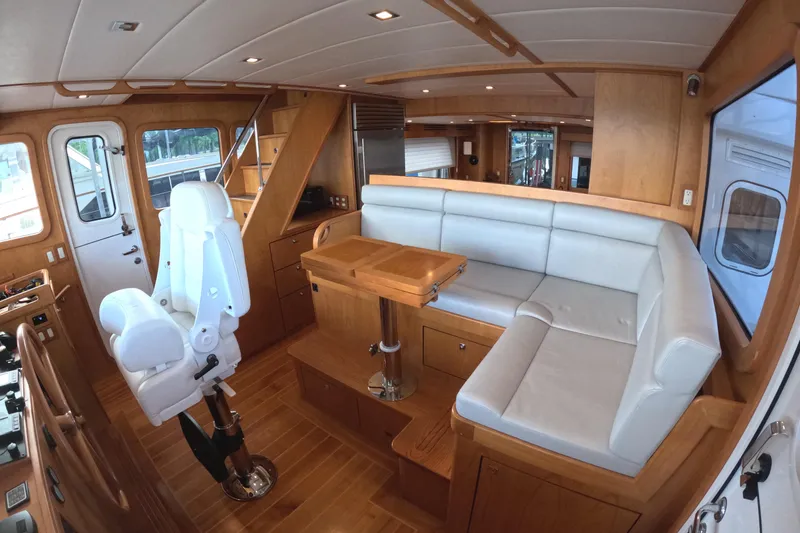 Slide: The Image of Luxurious interior of 2021 Kadey-Krogen 50 Open yacht with seating and helm chair. - 16