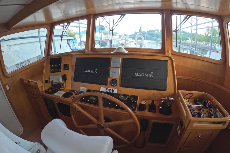Slide: The Image of Pilothouse of 2021 Kadey-Krogen 50 Open with Garmin navigation system. - 18