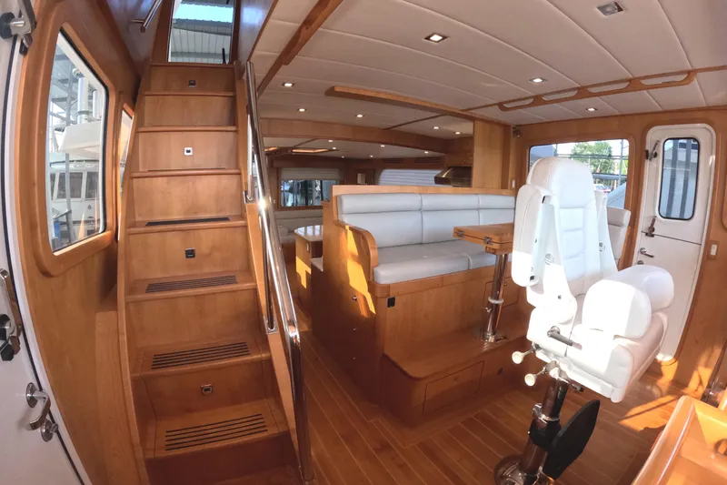 Slide: The Image of Luxurious interior of 2021 Kadey-Krogen 50 Open yacht with wooden finishes and seating. - 19