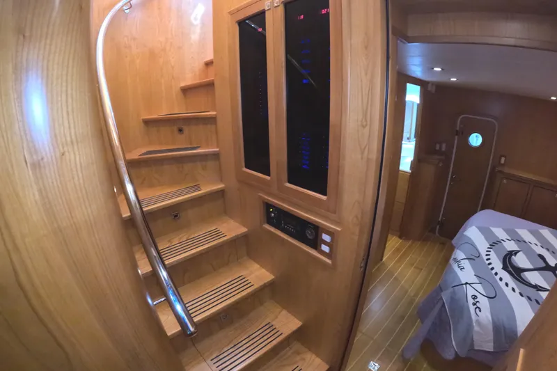 Slide: The Image of Interior of 2021 Kadey-Krogen 50 Open yacht with wooden stairs and cozy bedroom. - 20