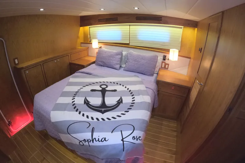 Slide: The Image of Luxurious bedroom in 2021 Kadey-Krogen 50 Open yacht with anchor-themed bedding. - 22