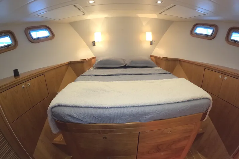 Slide: The Image of Luxurious cabin interior of 2021 Kadey-Krogen 50 Open yacht with cozy bed and wooden furnishings. - 28