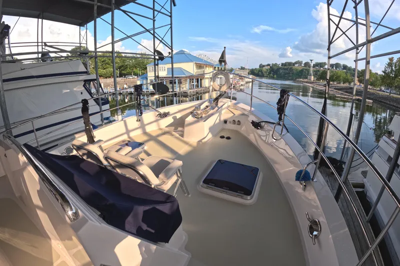 Slide: The Image of Kadey-Krogen 50 Open 2021 yacht docked, featuring spacious deck and scenic waterfront view. - 36