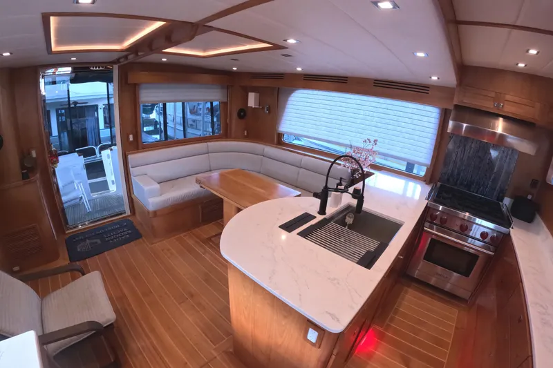 Slide: The Image of Luxurious interior of 2021 Kadey-Krogen 50 Open yacht with modern kitchen and seating area. - 4