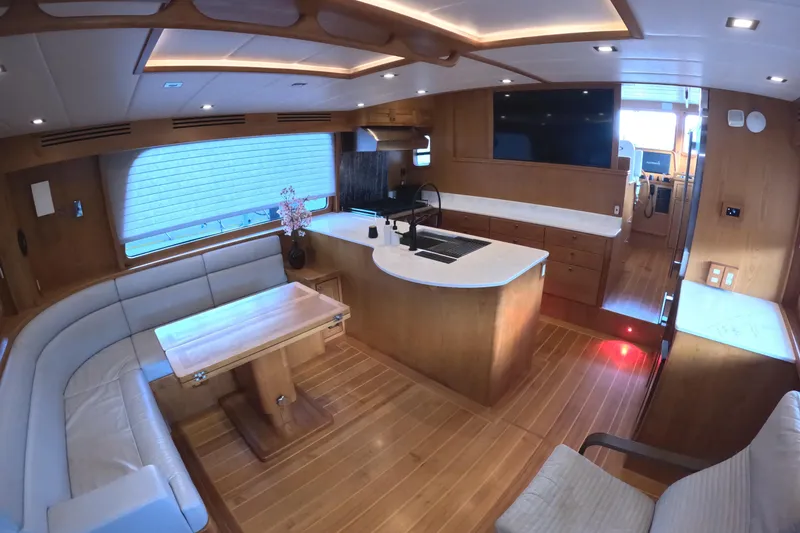 Slide: The Image of Luxurious interior of 2021 Kadey-Krogen 50 Open yacht with modern kitchen and seating area. - 5