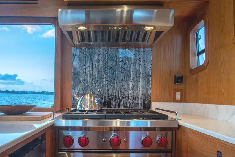 Slide: The Image of Modern kitchen in 2021 Kadey-Krogen 50 Open yacht with scenic window view. - 8
