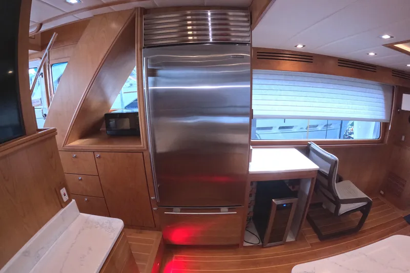 Slide: The Image of Luxurious interior of 2021 Kadey-Krogen 50 Open yacht with modern kitchen amenities. - 9