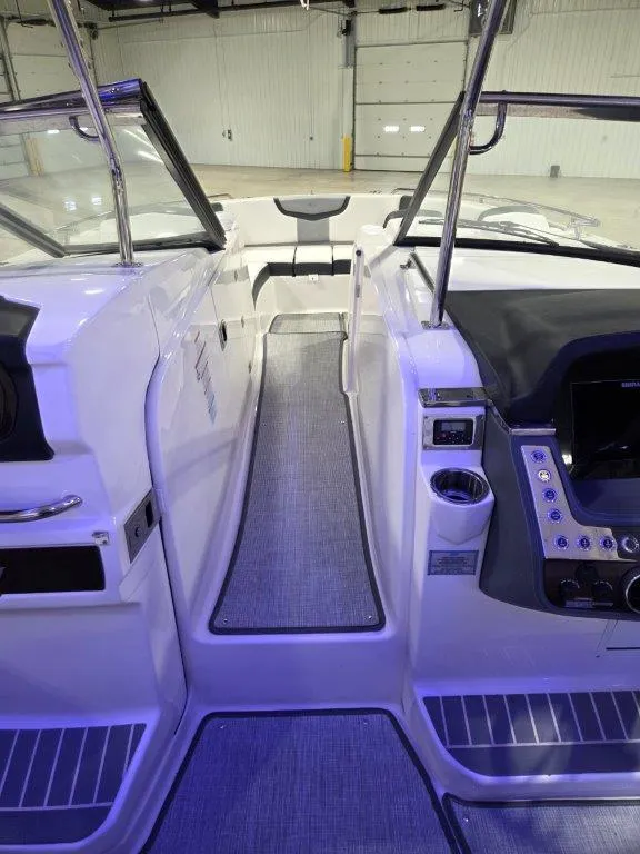 Slide: The Image of Interior view of 2022 Chaparral 347 SSX boat cockpit with modern controls and seating. - 11