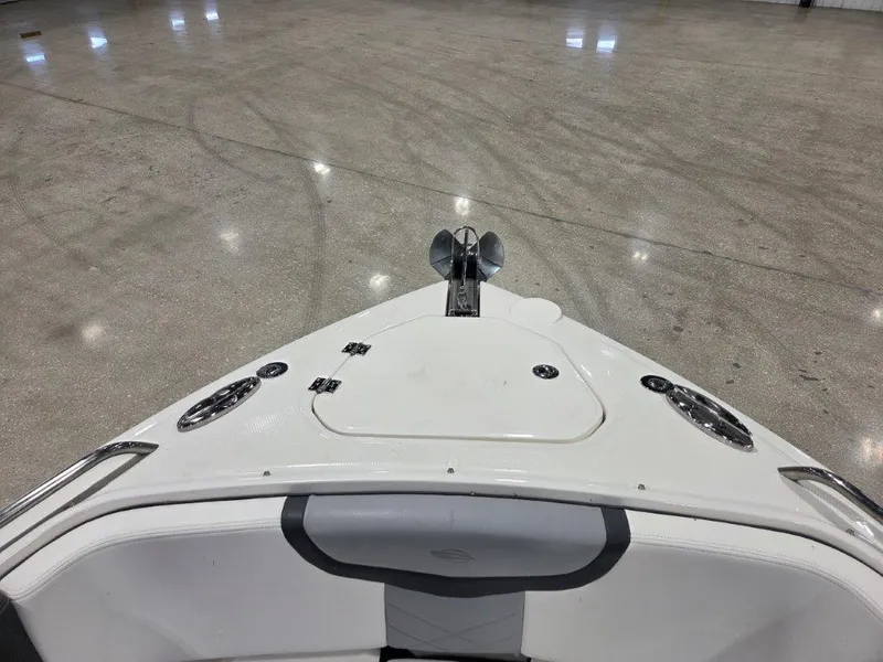 Slide: The Image of 2022 Chaparral 347 SSX boat bow with anchor, indoors on polished floor. - 14