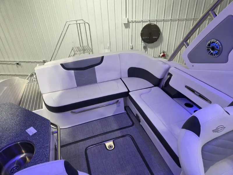 Slide: The Image of 2022 Chaparral 347 SSX boat interior with white seating and modern design. - 15