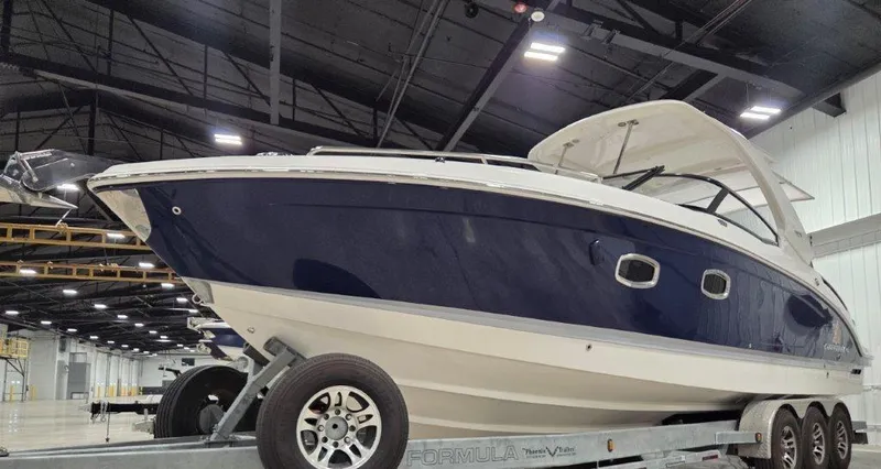 Slide: The Image of 2022 Chaparral 347 SSX boat on trailer in indoor showroom. - 2