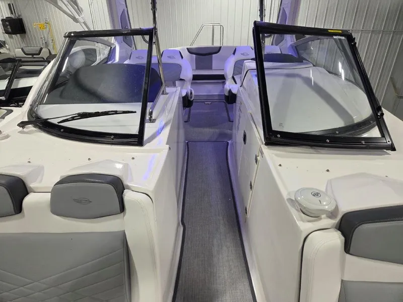 Slide: The Image of 2022 Chaparral 347 SSX boat interior with open windshield and seating area. - 20