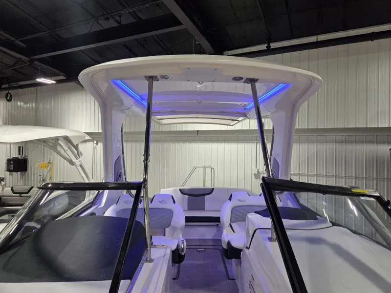 Slide: The Image of 2022 Chaparral 347 SSX boat interior with modern seating and blue LED lighting. - 21