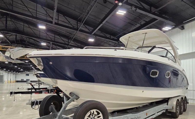 Slide: The Image of 2022 Chaparral 347 SSX boat on trailer in indoor showroom. - 3