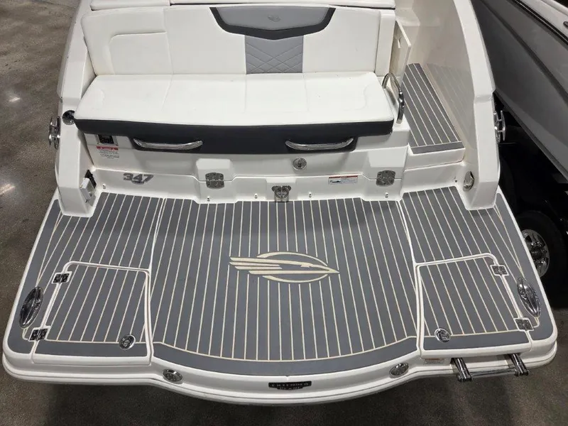 Slide: The Image of 2022 Chaparral 347 SSX boat deck with sleek gray and white design. - 34