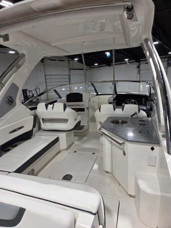 Slide: The Image of 2022 Chaparral 347 SSX boat interior with seating and kitchenette. - 36