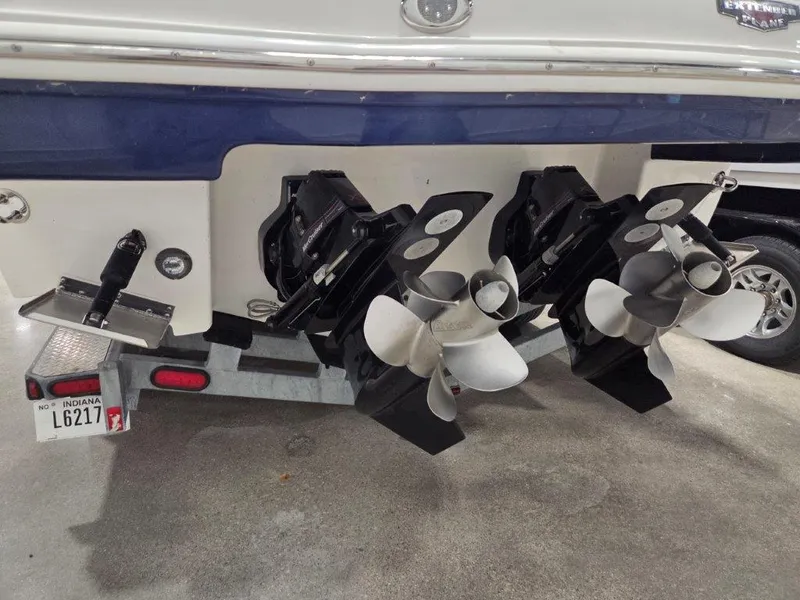 Slide: The Image of 2022 Chaparral 347 SSX boat stern with dual propellers on a trailer. - 4