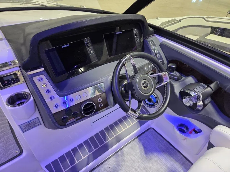 Slide: The Image of 2022 Chaparral 347 SSX boat dashboard with modern controls and steering wheel. - 42