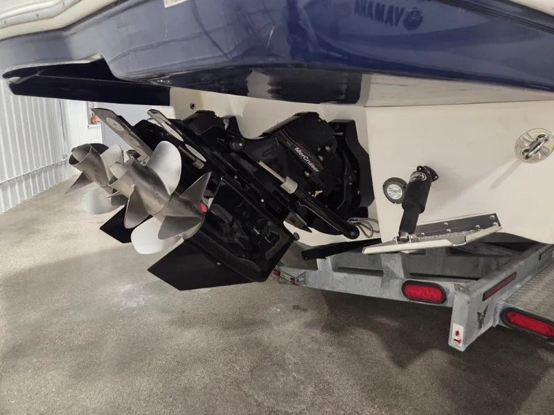 Slide: The Image of 2022 Chaparral 347 SSX boat stern with dual propellers on a trailer. - 5