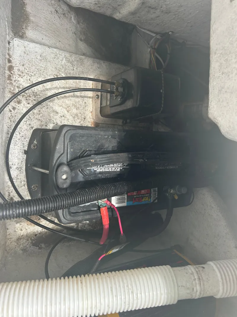 Slide: The Image of Battery compartment of a 2001 Concept 23 CC boat with wiring and cables. - 10