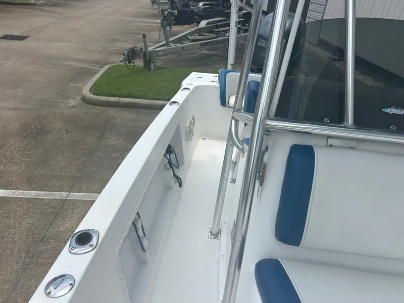 Slide: The Image of 2001 Concept 23 CC boat interior with blue and white seating, docked on concrete. - 14