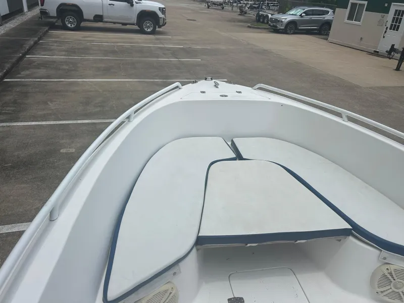 Slide: The Image of Bow view of a 2001 Concept 23 CC boat in a parking lot. - 15