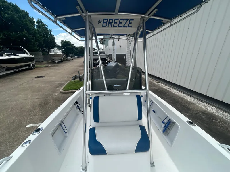 Slide: The Image of Center console boat "The Breeze" with blue and white seating, Concept 23 CC, 2001 model. - 18