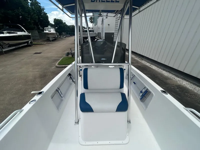 Slide: The Image of Center console boat with blue and white seating, Concept 23 CC, 2001 model. - 19